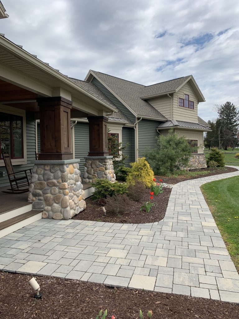 Front of a home with stone slab walkway